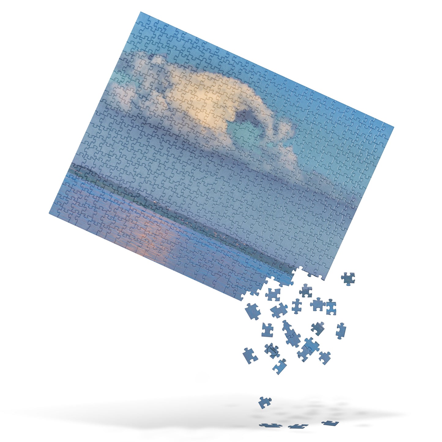 Jigsaw puzzle with a partially completed design of a cloud and landscape.